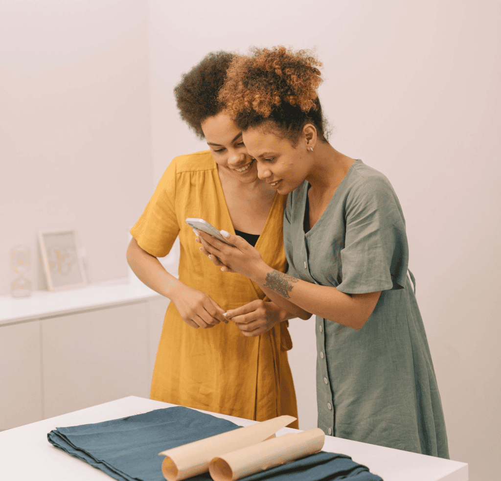 coworkers leaning over a phone
