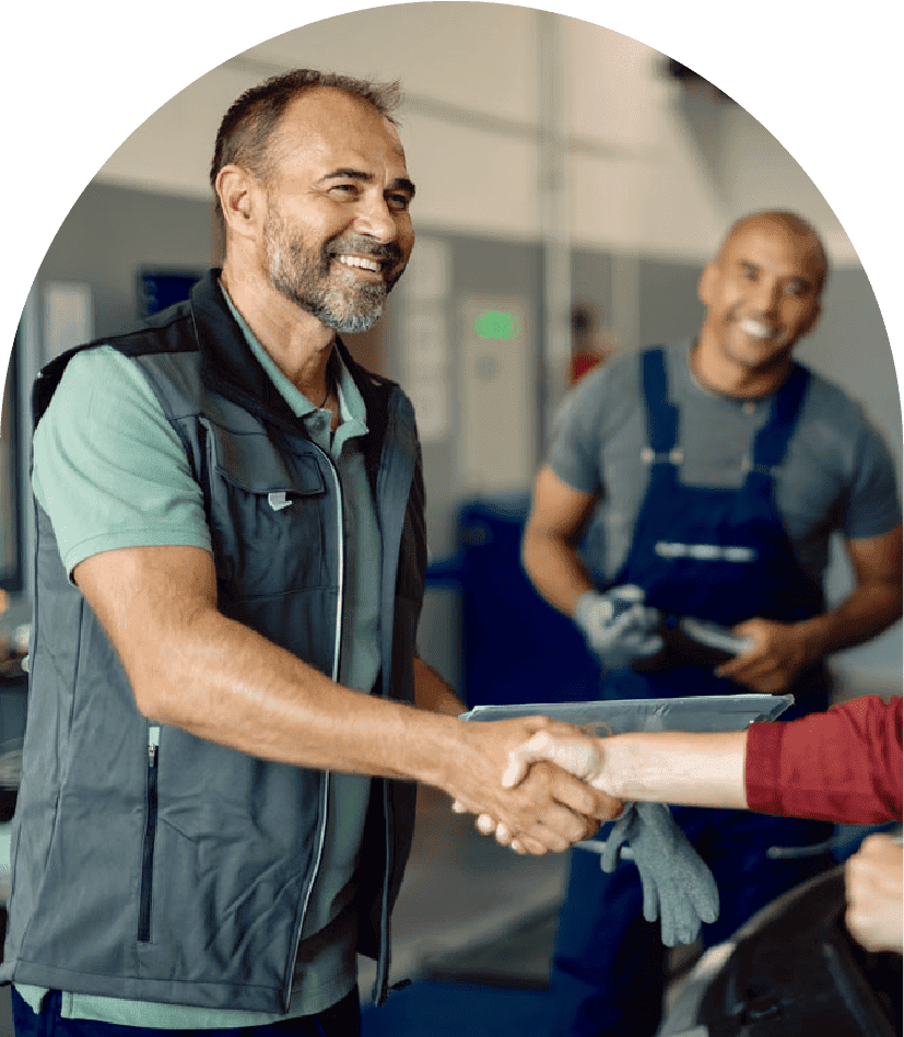 Small business owner shaking hands with client