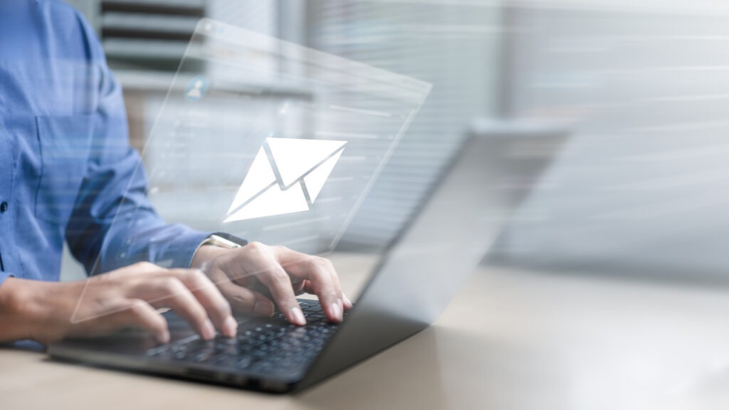 Man checking an email on his laptop